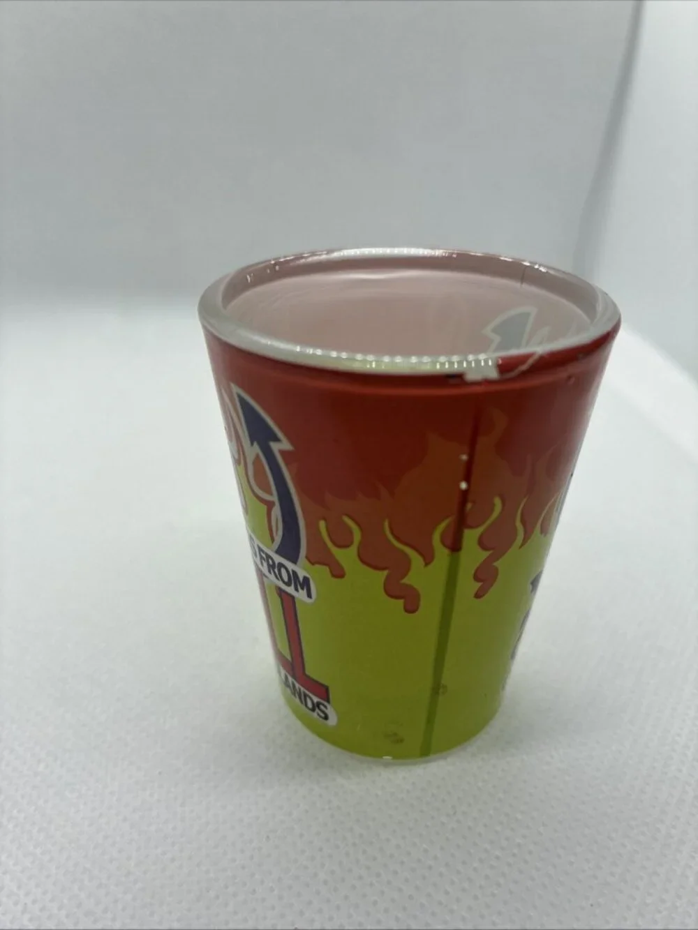 Vintage Greetings From Hell Cayman Islands Shot Glass Souvenir Red Green Flames
